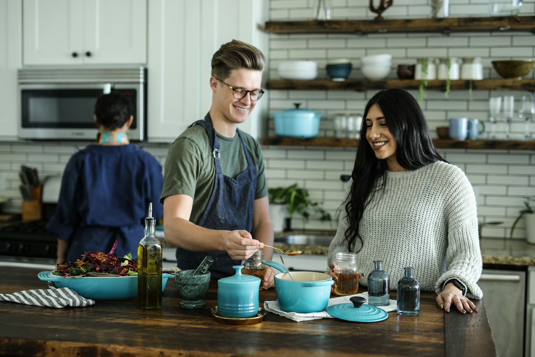 Students learning together in a bright teaching kitchen